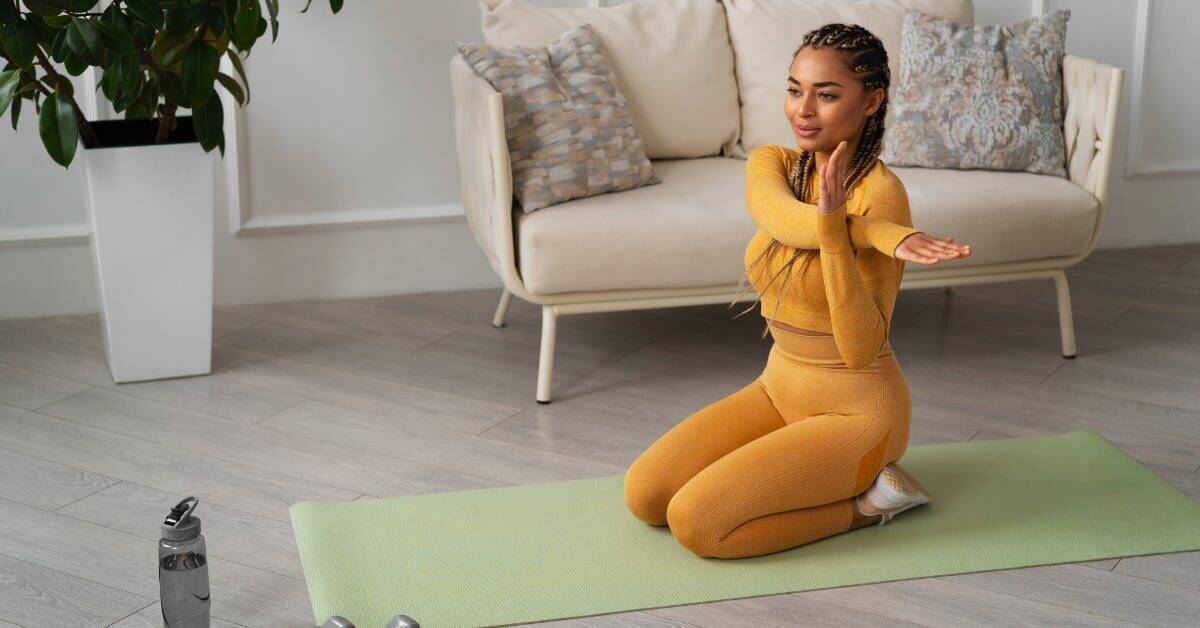 Person practicing yoga on mat.