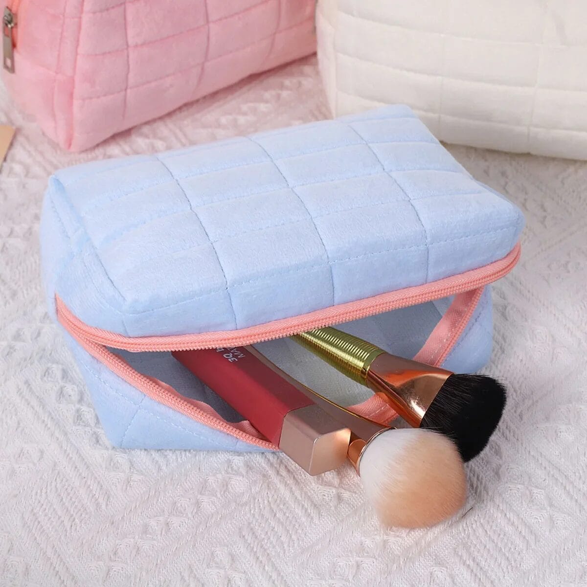 Cosmetic bag with makeup brushes inside